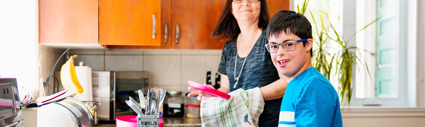 autistic boy doing dishes