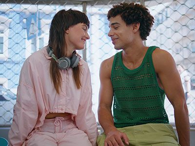 Two teens smiling at each other