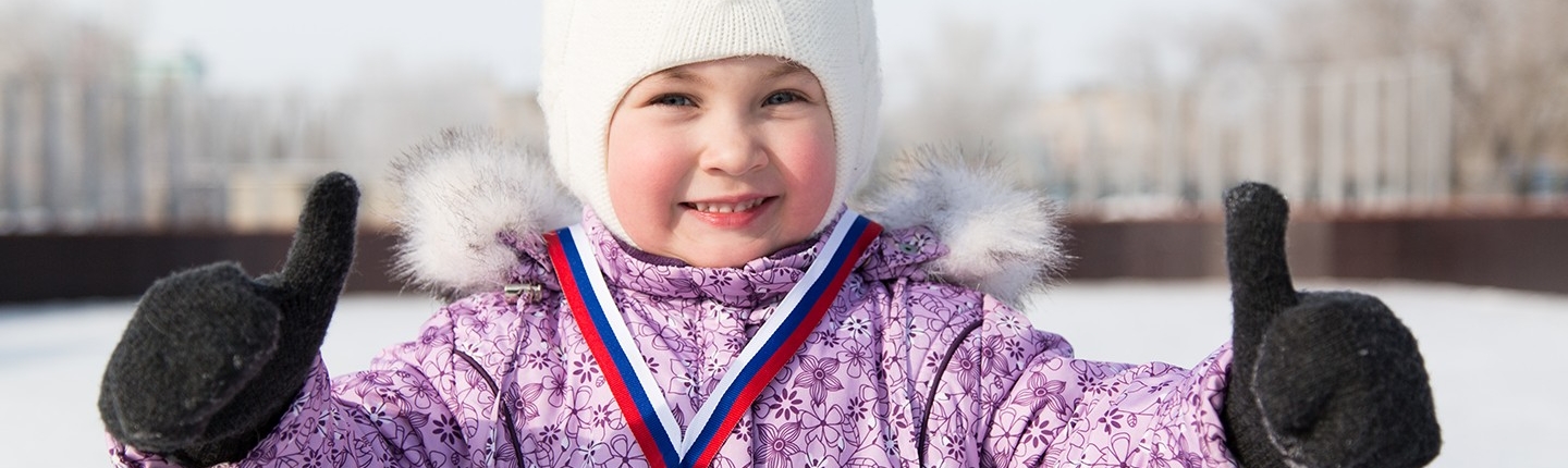 child with silver medal