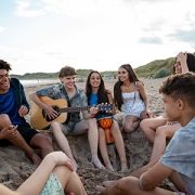 teens hanging out at the beach