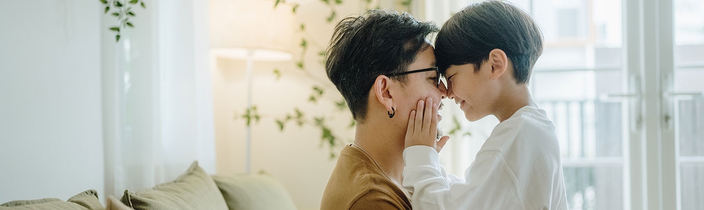 father and son cuddling