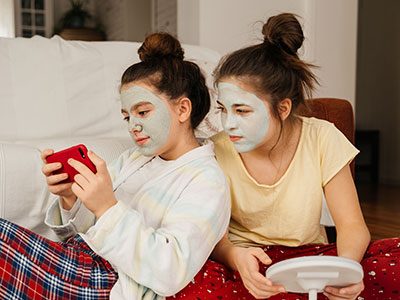 Teen girls with skin care face masks on