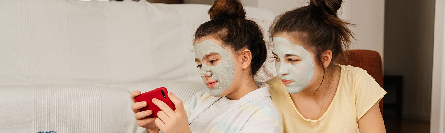 Teen girls with skin care face masks on