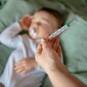 sleeping baby with thermometer