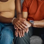 closeup of couple holding hands
