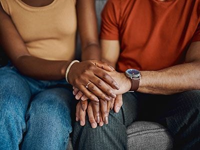 closeup of couple holding hands